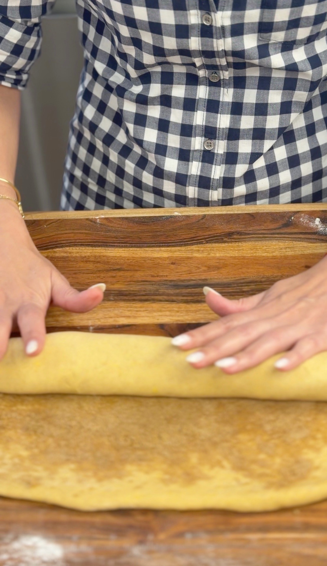 Rolling the filled dough into a log