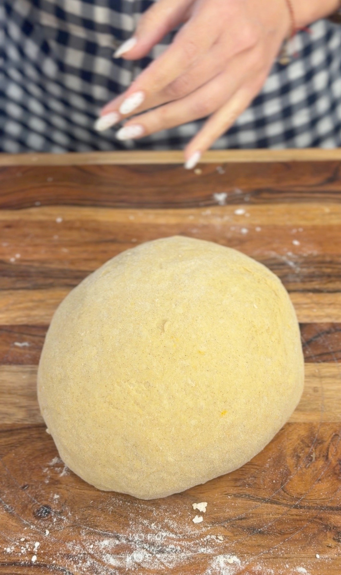 Kneaded pumpkin dough on the wooden board