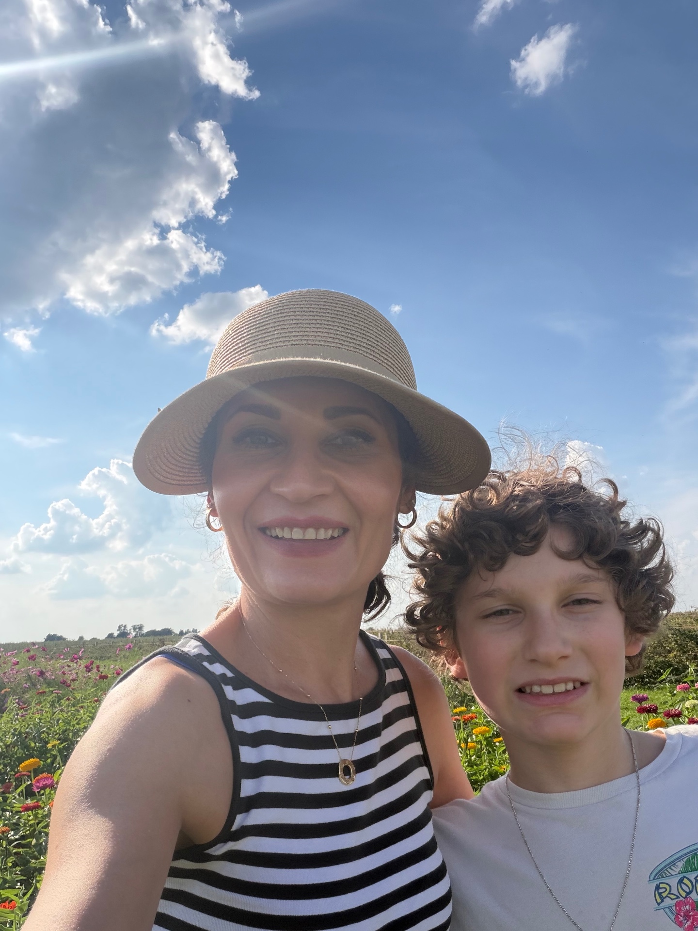 Toti and her son in the flower field at the farm