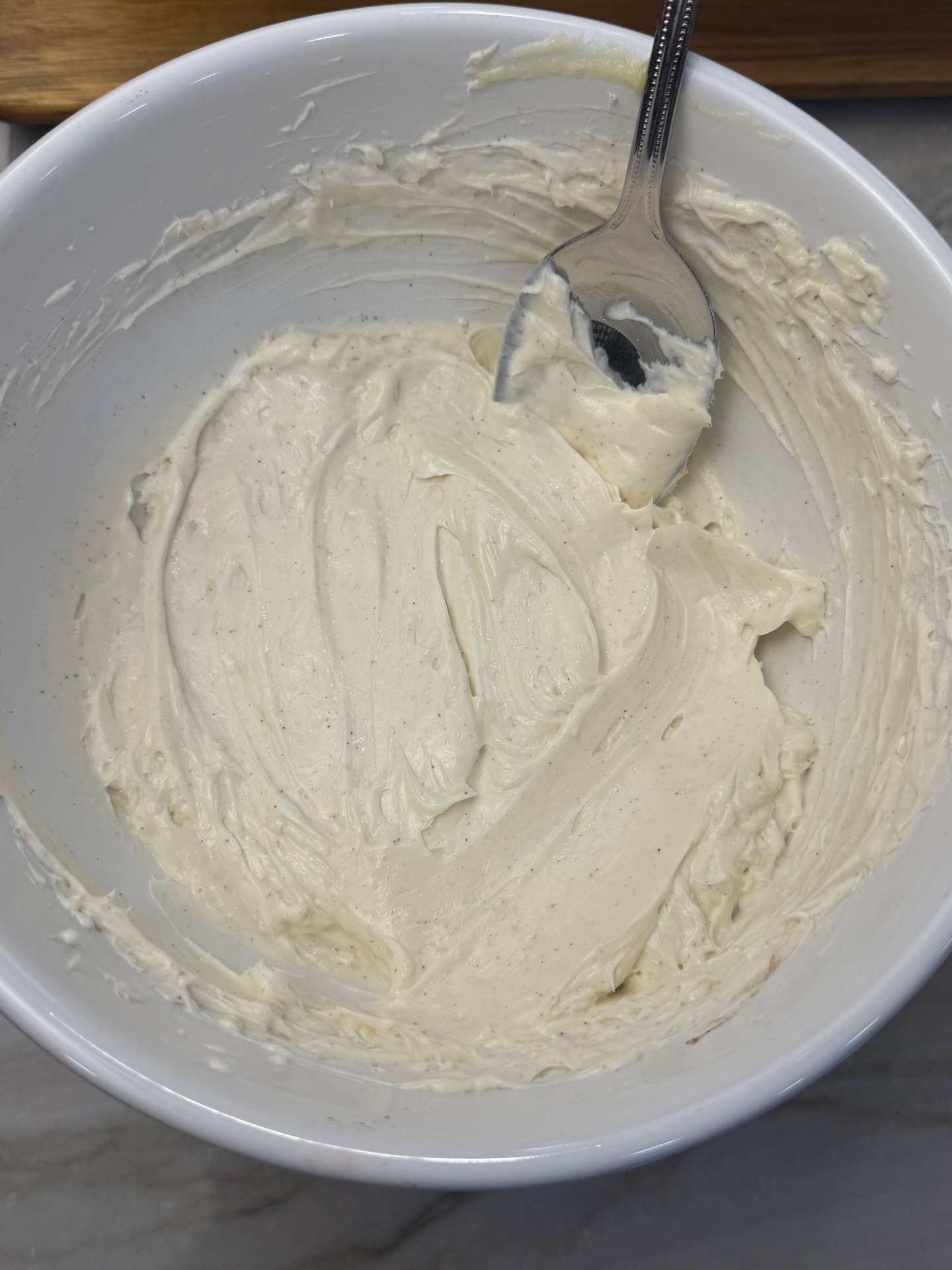 Cream cheese frosting in a mixing bowl